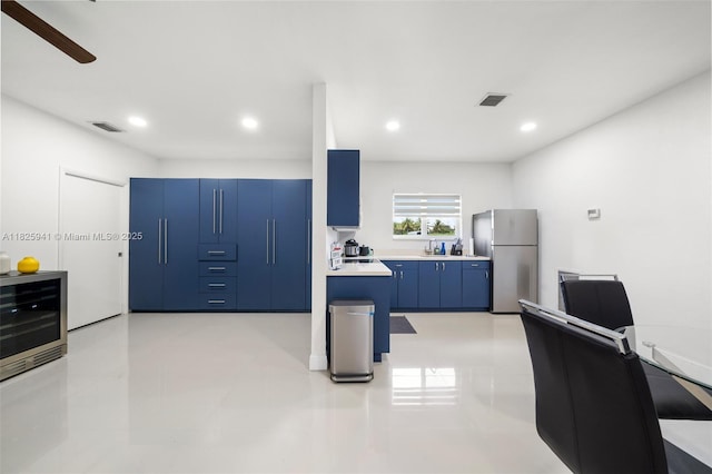 17490 SW 70th Pl, Southwest Ranches, FL 33331 - kitchen featuring freestanding refrigerator, blue cabinets, light countertops, ceiling fan, and recessed lighting