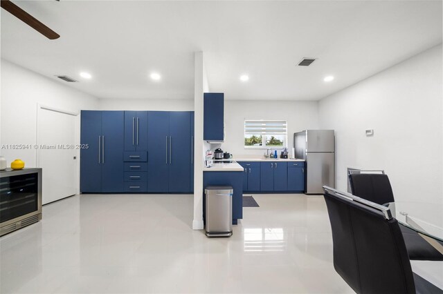 17490 SW 70th Pl, Southwest Ranches, FL 33331 - kitchen featuring freestanding refrigerator, blue cabinets, light countertops, ceiling fan, and recessed lighting