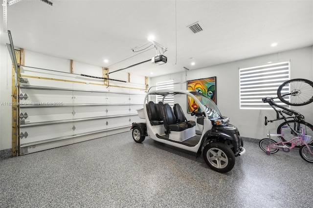 17490 SW 70th Pl, Southwest Ranches, FL 33331 - garage featuring a garage door opener and recessed lighting