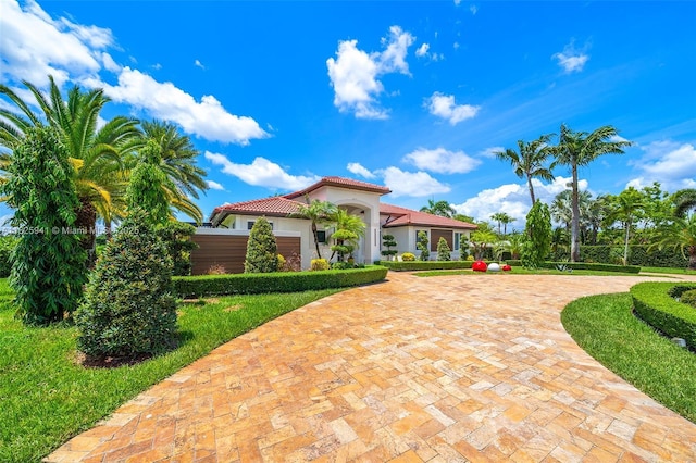 17490 SW 70th Pl, Southwest Ranches, FL 33331 - mediterranean / spanish house with a tile roof, stucco siding, and driveway
