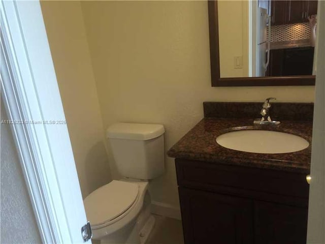 2025 NE 164th St Unit 901, North Miami Beach, FL 33162 - bathroom featuring vanity and toilet