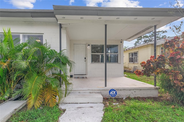 1408 N 23rd St, Fort Pierce, FL 34950 - entrance to property featuring concrete block siding and covered porch