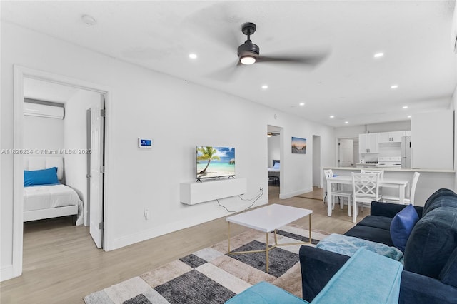 1408 N 23rd St, Fort Pierce, FL 34950 - living room with an AC wall unit, light wood-style flooring, recessed lighting, and a ceiling fan