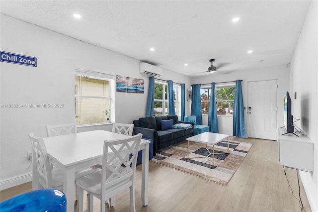 1408 N 23rd St, Fort Pierce, FL 34950 - dining area featuring light wood-style floors, recessed lighting, a wall unit AC, and a ceiling fan