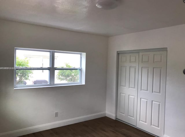 6710 SW 18th Ct, North Lauderdale, FL 33068 - unfurnished bedroom with dark wood-style flooring and a closet