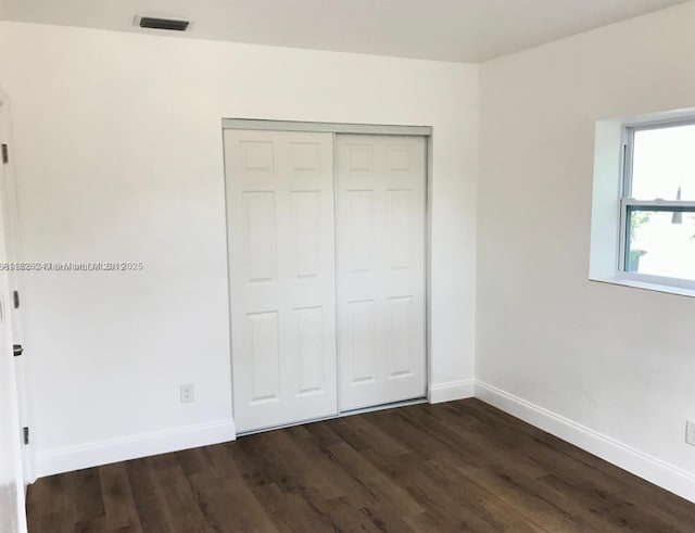 6710 SW 18th Ct, North Lauderdale, FL 33068 - unfurnished bedroom with dark wood-style floors and a closet