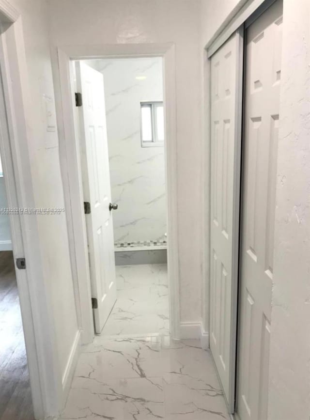 6710 SW 18th Ct, North Lauderdale, FL 33068 - hall featuring marble finish flooring and baseboards