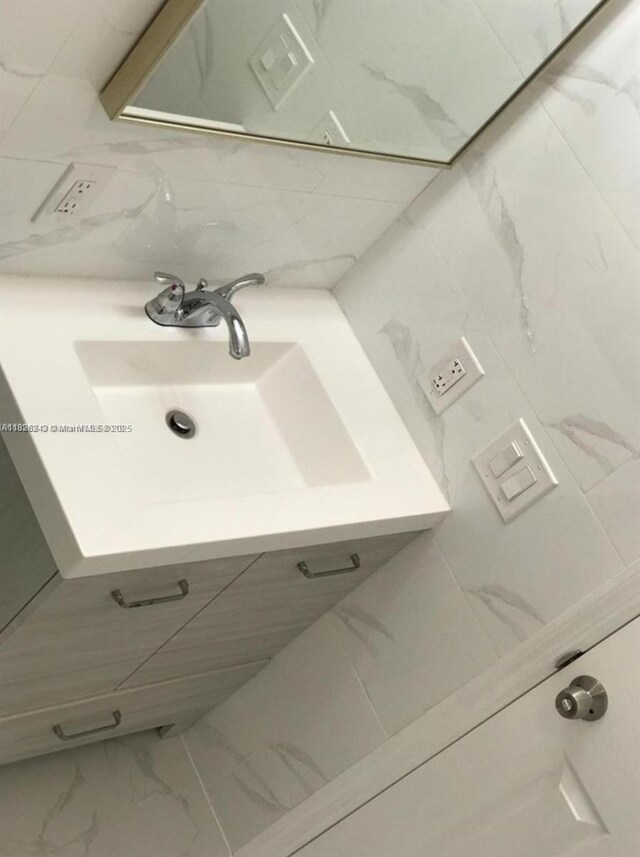 6710 SW 18th Ct, North Lauderdale, FL 33068 - bathroom featuring marble look tiles and vanity