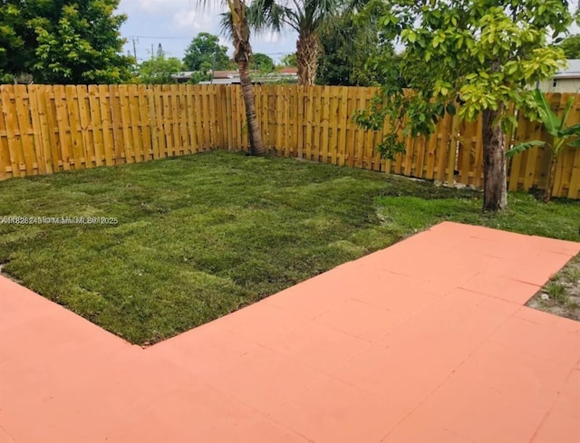 6710 SW 18th Ct, North Lauderdale, FL 33068 - fenced backyard with a patio area