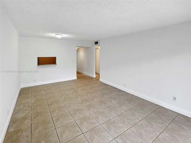 5201 Geneva Way Unit 201, Doral, FL 33166 - empty room featuring a textured ceiling and light tile patterned floors
