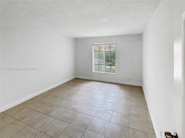 5201 Geneva Way Unit 201, Doral, FL 33166 - empty room featuring light tile patterned flooring and a textured ceiling