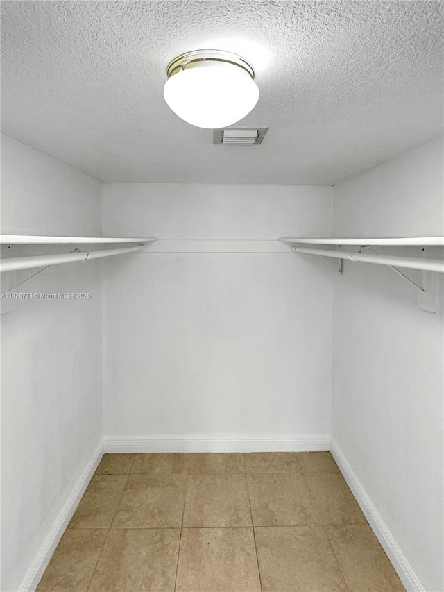 5201 Geneva Way Unit 201, Doral, FL 33166 - spacious closet featuring tile patterned flooring