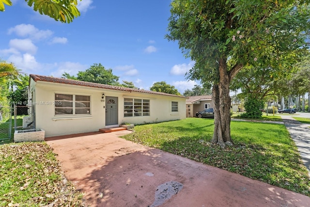 919 NE 4th St, Hallandale Beach, FL 33009 - mediterranean / spanish-style house featuring stucco siding and a tiled roof