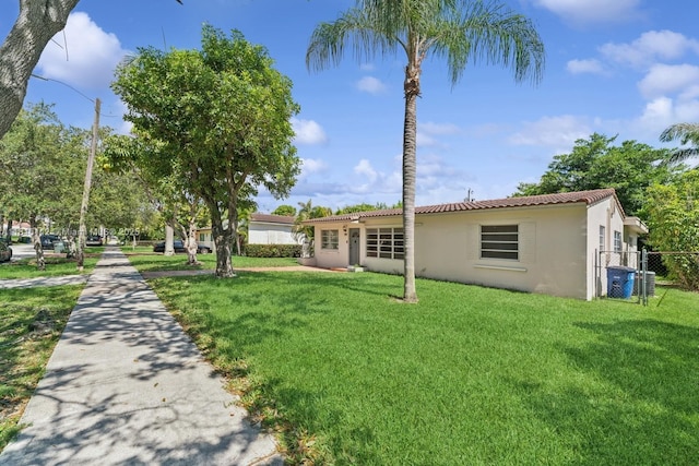919 NE 4th St, Hallandale Beach, FL 33009 - view of front of home featuring stucco siding and a tiled roof