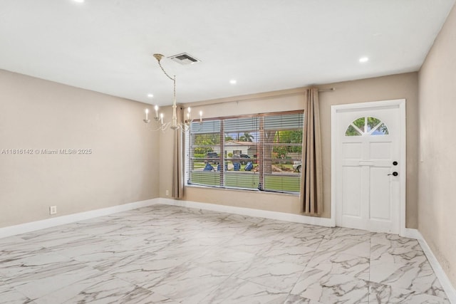919 NE 4th St, Hallandale Beach, FL 33009 - foyer featuring a chandelier, healthy amount of natural light, recessed lighting, and marble finish flooring