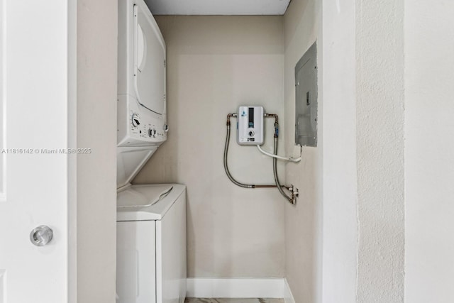 919 NE 4th St, Hallandale Beach, FL 33009 - laundry area featuring stacked washer / dryer and electric panel