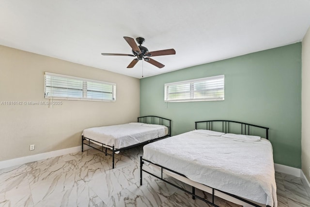 919 NE 4th St, Hallandale Beach, FL 33009 - bedroom with marble look tiles, multiple windows, and ceiling fan