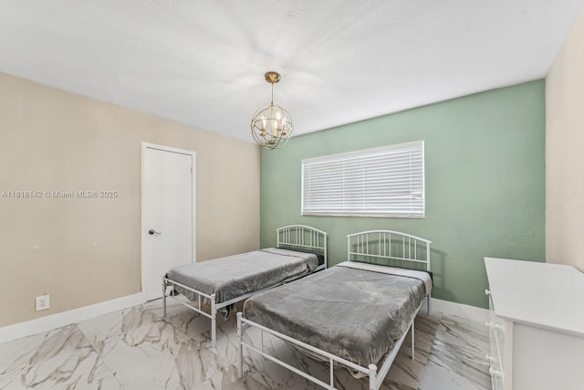 919 NE 4th St, Hallandale Beach, FL 33009 - bedroom with marble look tile flooring and a chandelier