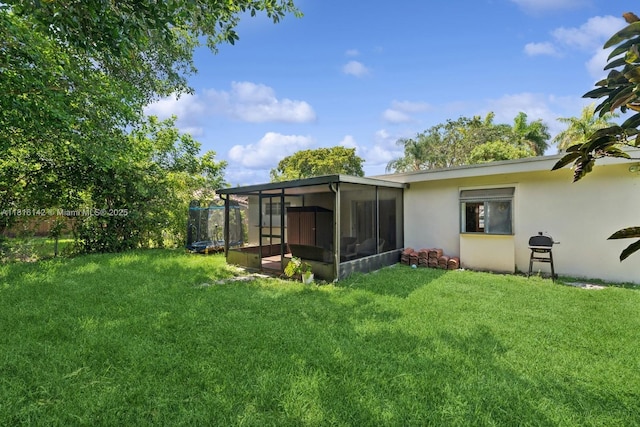 919 NE 4th St, Hallandale Beach, FL 33009 - view of yard featuring a sunroom