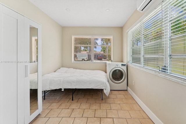 919 NE 4th St, Hallandale Beach, FL 33009 - bedroom with washer / clothes dryer and baseboards