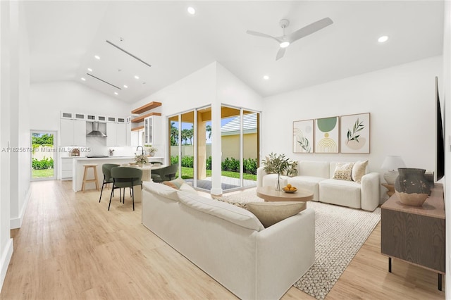 9047 Baybury Ln, West Palm Beach, FL 33411 - living area featuring light wood-type flooring, recessed lighting, high vaulted ceiling, and a ceiling fan