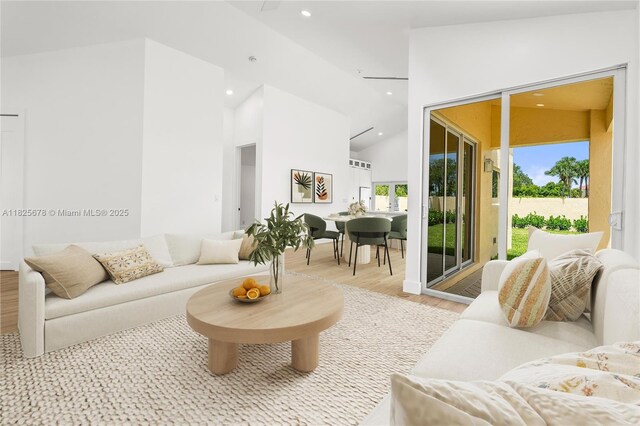 9047 Baybury Ln, West Palm Beach, FL 33411 - living area with light wood-style flooring, recessed lighting, and high vaulted ceiling
