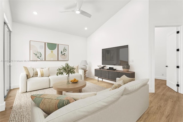 9047 Baybury Ln, West Palm Beach, FL 33411 - living room featuring light wood-style floors, a ceiling fan, recessed lighting, and high vaulted ceiling