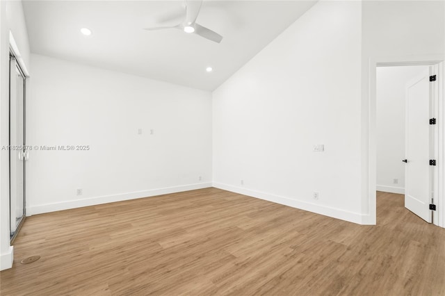 9047 Baybury Ln, West Palm Beach, FL 33411 - empty room with ceiling fan, light wood-style floors, recessed lighting, and high vaulted ceiling