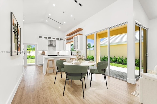 9047 Baybury Ln, West Palm Beach, FL 33411 - dining space featuring recessed lighting, light wood finished floors, and high vaulted ceiling