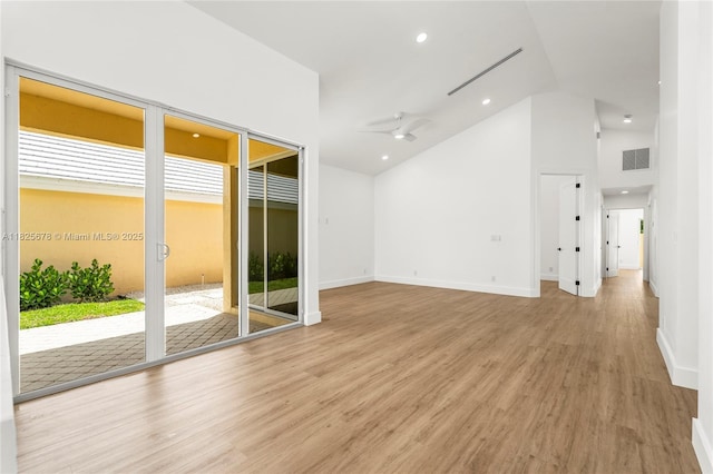 9047 Baybury Ln, West Palm Beach, FL 33411 - empty room with light wood finished floors, a ceiling fan, recessed lighting, and high vaulted ceiling
