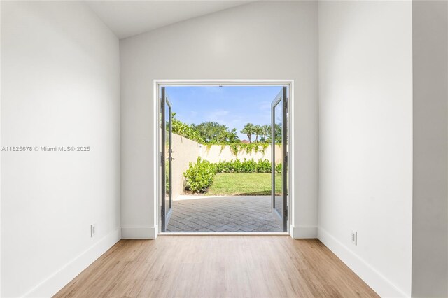 9047 Baybury Ln, West Palm Beach, FL 33411 - empty room featuring baseboards and wood finished floors