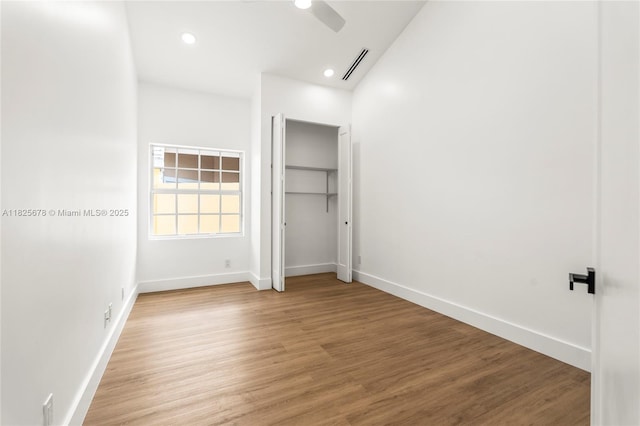 9047 Baybury Ln, West Palm Beach, FL 33411 - unfurnished bedroom featuring light wood-style flooring, recessed lighting, and a ceiling fan