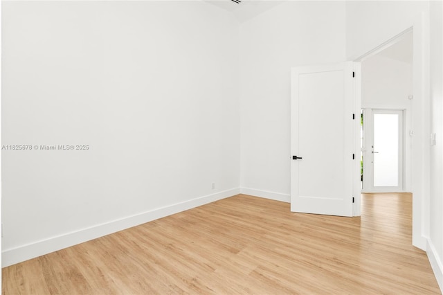 9047 Baybury Ln, West Palm Beach, FL 33411 - empty room featuring light wood finished floors and baseboards