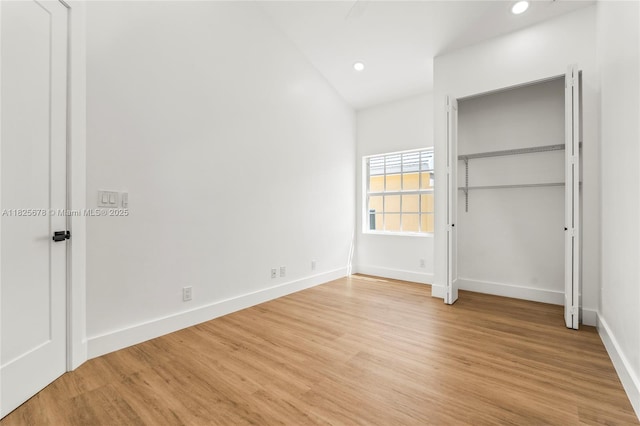 9047 Baybury Ln, West Palm Beach, FL 33411 - unfurnished bedroom with recessed lighting and light wood finished floors