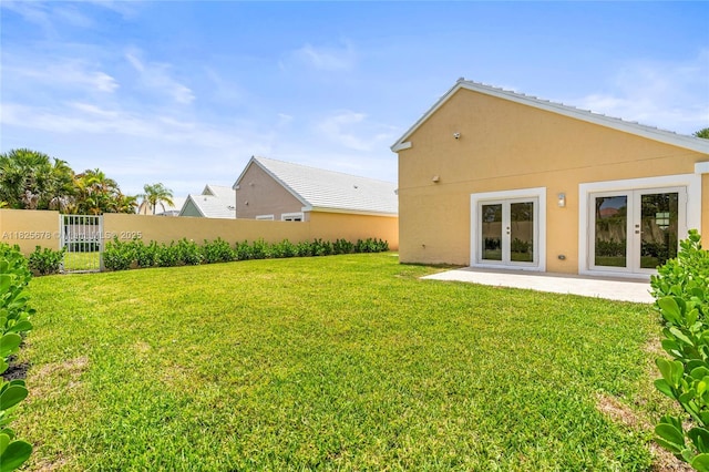 9047 Baybury Ln, West Palm Beach, FL 33411 - view of yard featuring french doors and a patio