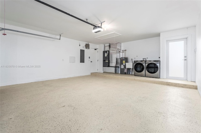 9047 Baybury Ln, West Palm Beach, FL 33411 - garage with separate washer and dryer, water heater, heating unit, a garage door opener, and electric panel