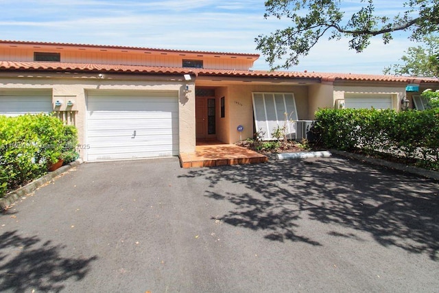 14716 Breckness Pl, Miami Lakes, FL 33016 - view of front of home featuring stucco siding, a garage, and driveway