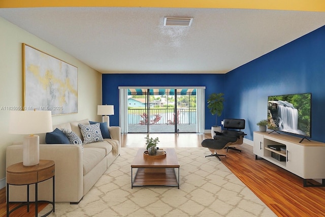 14716 Breckness Pl, Miami Lakes, FL 33016 - living area with wood finished floors and a textured ceiling