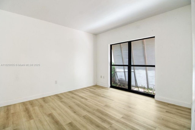 14716 Breckness Pl, Miami Lakes, FL 33016 - unfurnished room featuring light wood-style flooring and baseboards