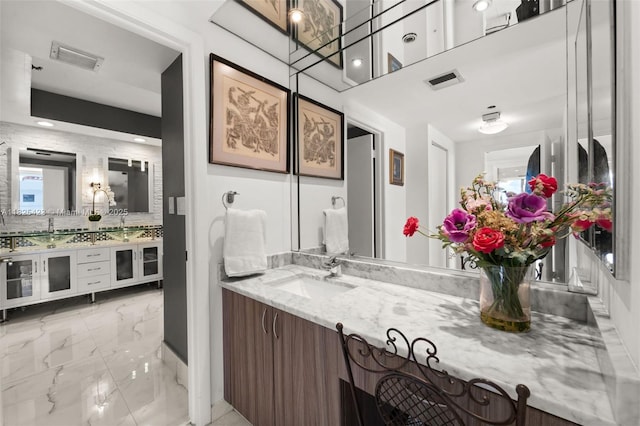 20281 E Country Club Dr Unit 201, Aventura, FL 33180 - bathroom with marble tiled floors, vanity, and recessed lighting