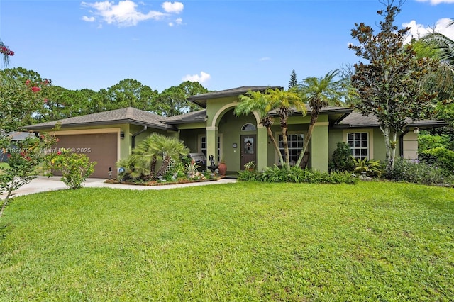 1025 SW Placetas Ave, Port St Lucie, FL 34953 - view of front of home featuring stucco siding, a front lawn, an attached garage, and concrete driveway