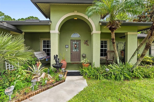 1025 SW Placetas Ave, Port St Lucie, FL 34953 - property entrance featuring stucco siding and a porch