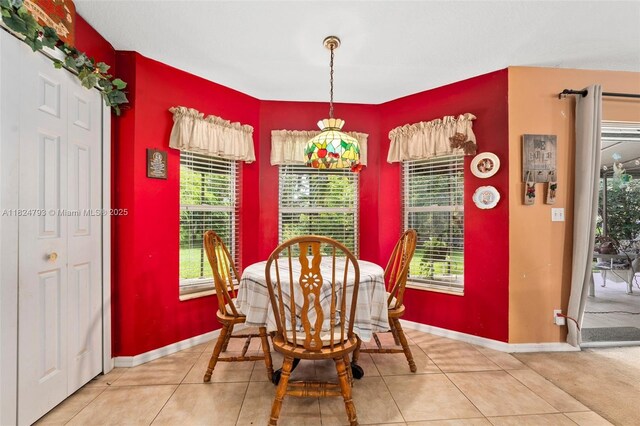 1025 SW Placetas Ave, Port St Lucie, FL 34953 - dining space featuring light tile patterned flooring and healthy amount of natural light