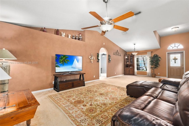 1025 SW Placetas Ave, Port St Lucie, FL 34953 - living room with carpet, a ceiling fan, arched walkways, and lofted ceiling