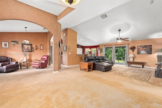 1025 SW Placetas Ave, Port St Lucie, FL 34953 - carpeted living area with arched walkways and a ceiling fan