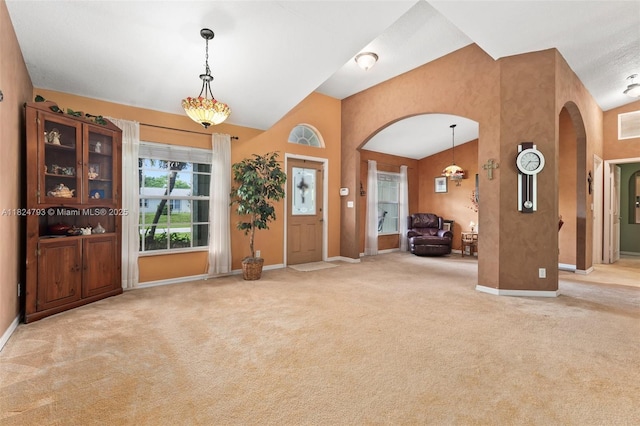 1025 SW Placetas Ave, Port St Lucie, FL 34953 - carpeted foyer with arched walkways and high vaulted ceiling