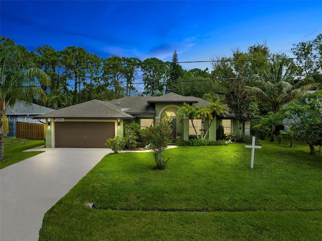 1025 SW Placetas Ave, Port St Lucie, FL 34953 - view of front of home with driveway, an attached garage, stucco siding, and a shingled roof