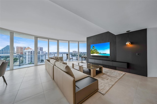401 N Birch Rd Unit 1100, Fort Lauderdale, FL 33304 - living room with a view of city, expansive windows, an accent wall, and light tile patterned flooring