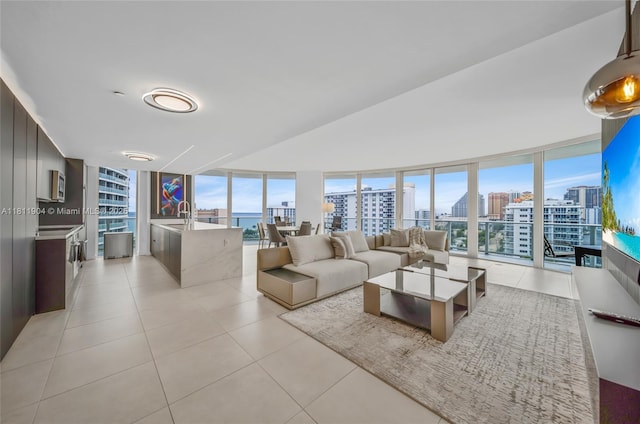 401 N Birch Rd Unit 1100, Fort Lauderdale, FL 33304 - living room featuring a city view, floor to ceiling windows, healthy amount of natural light, and light tile patterned floors