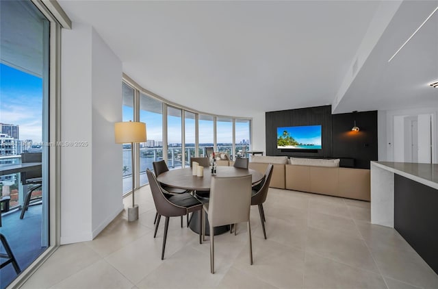 401 N Birch Rd Unit 1100, Fort Lauderdale, FL 33304 - dining area featuring expansive windows, a city view, and light tile patterned flooring